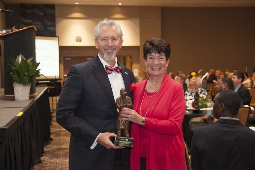 Miracles In Sight President and CEO Dean Vavra is pictured with IFB Solutions Board Chair Ann Johnston